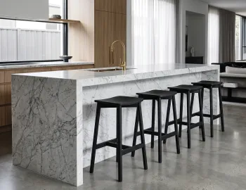 Home With Black Counter Stools In Kitchen