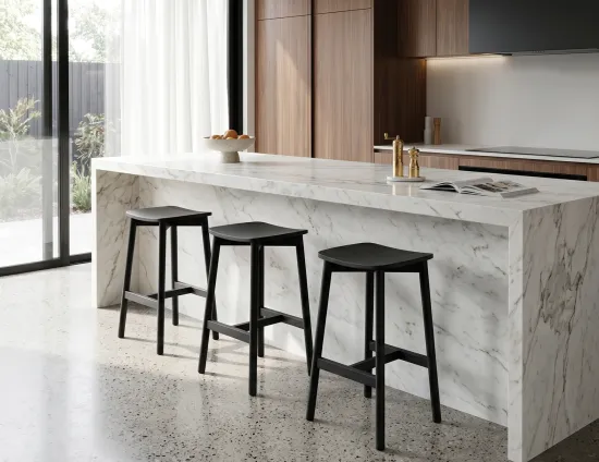 White Marble Kitchen With Black Stools